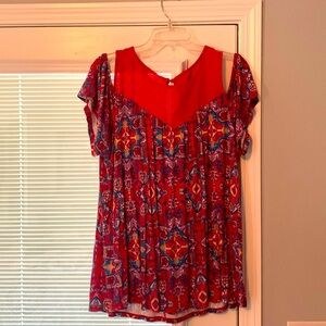 Super soft knit by Torrid. Off shoulder sleeve. Hangs well at waist.